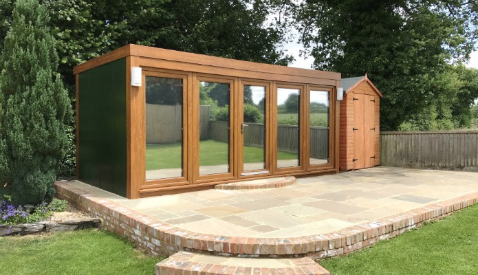 16' x 8' QCB garden office with oak windows and juniper green exterior walls